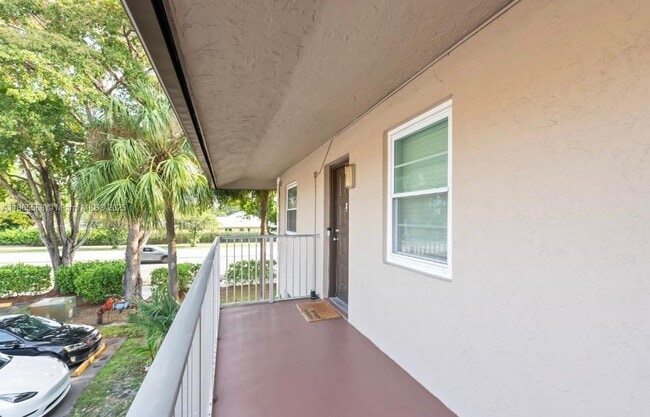 Building Photo - 8750 Royal Palm Blvd Unit 201-3 Rental