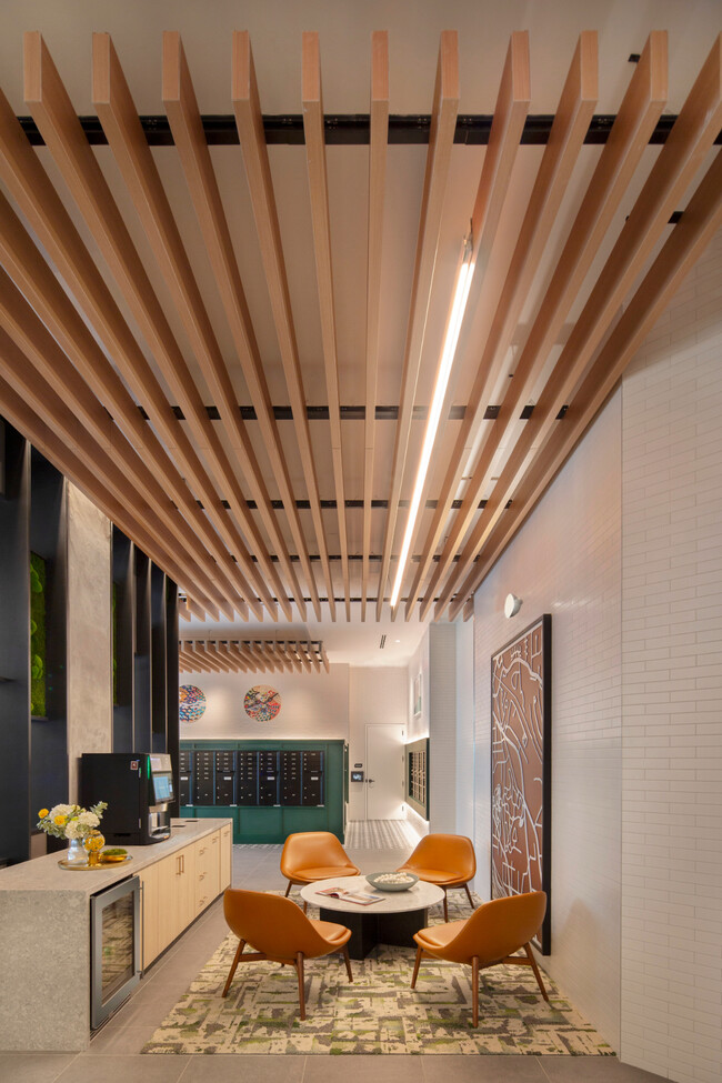 Lobby With Check-In Desk and Sitting Area - BRYKS Upper Westside Apartments