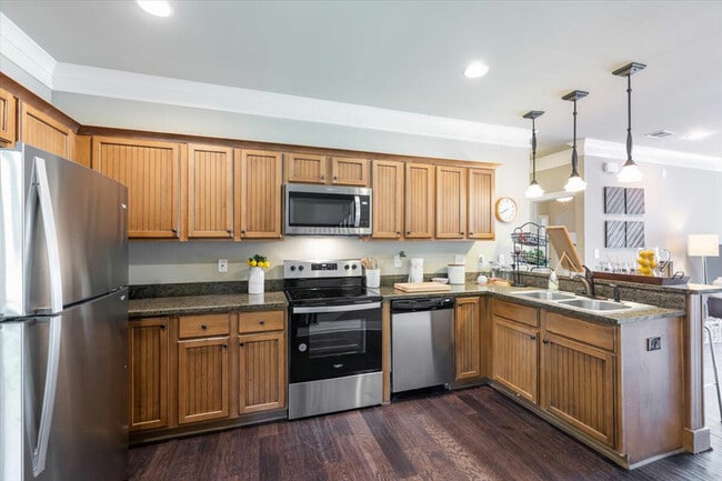 Enjoy a modern kitchen with stainless steel appliances at The Cottages of Hattiesburg.
