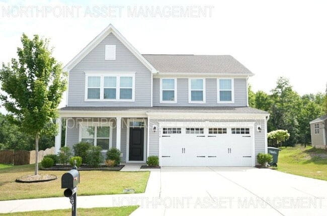 Building Photo - This wonderful home has a covered rocking ...