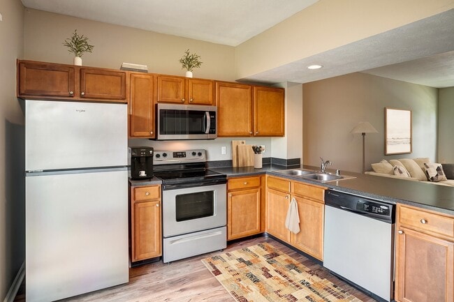 Kitchen with Stainless Steel Appliances - Riverford Crossing Apartments