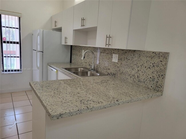 Building Photo - 7415 SW 153rd Ct Unit 203-7 Rental