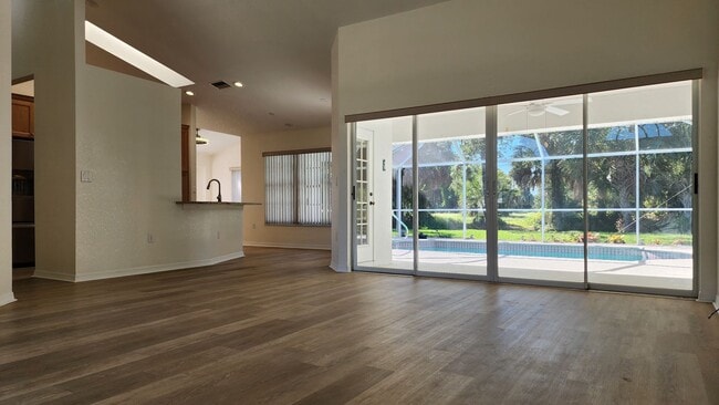 Photo - Fresh Paint, New Floors, and a Heated Pool...