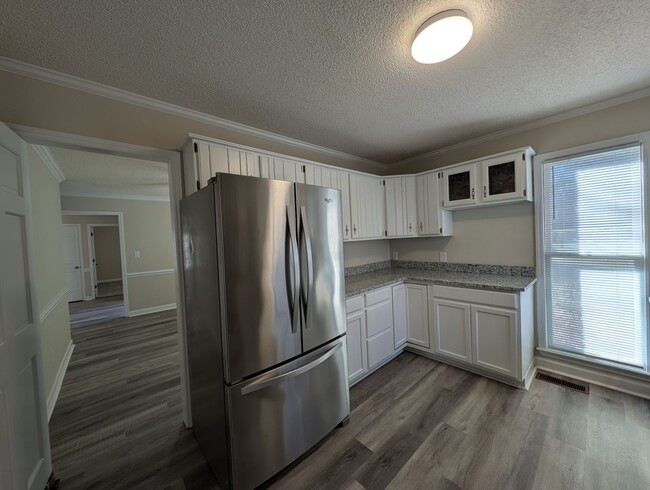 Photo - Gorgeous Brick 4 bedroom, 4 bathroom home located in the Farmwood community in Minthill!