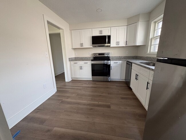 Building Photo - Fully Renovated 3BR/1.5BA – Prime Location + Lawn Care Included