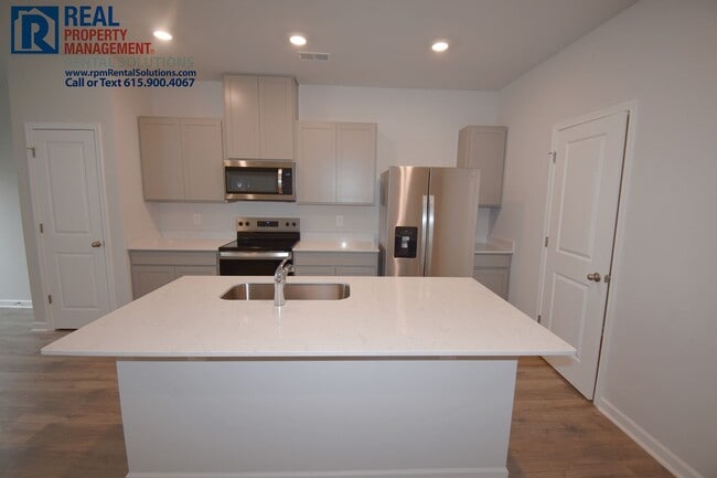 Photo - Like new 3bd townhome w/ attached 2 car garage & community pool! Washer/dryer included!