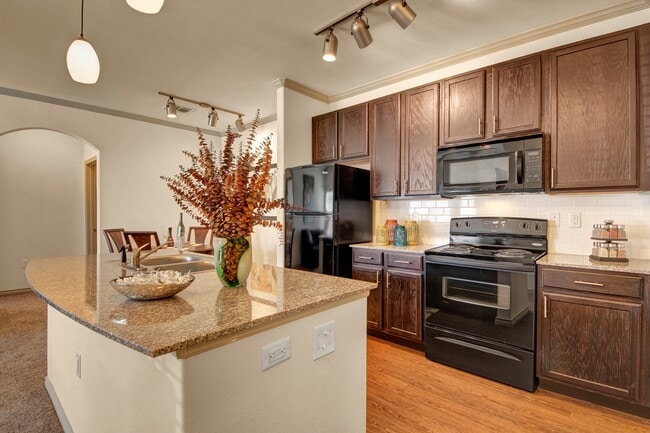 Large Kitchen Island with Granite Countertops - Liberty Pointe Apartments