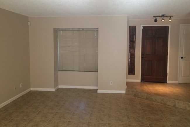 Living Room/Front Door - 4732 E Alamos Ave Unit 106