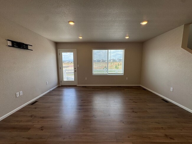 Photo - Modern 3-Level Home with Dual Balconies, Open Floor Plan & Bonus Flex Space