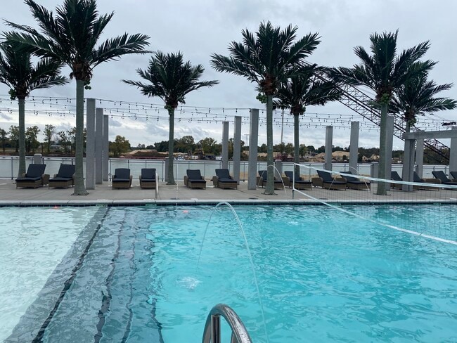 Overlook the river while enjoying the pool! - Apartments at Harbor Town