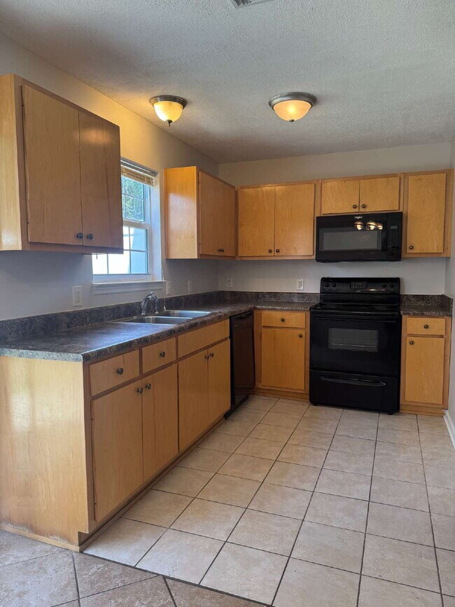 Photo - "Coastal Comfort Awaits: Charming 2-Bed, 2-Bath Townhouse on Catherine Street!" Unit A