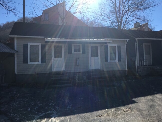 these two units have a sleeping area and a bathroom There is a centralized kitchen on the premises