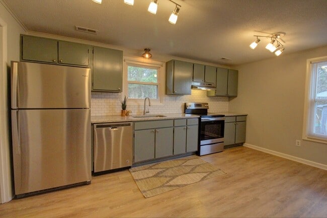 Photo - Available late August! Adorable + updated 3 bedroom home with fenced yard, 10 minutes from Downto...