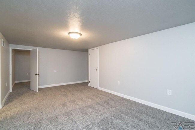 Large living room downstairs - 2700 S Summit Ave