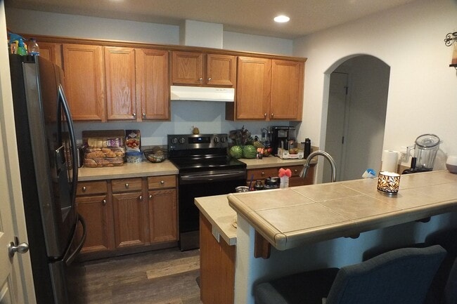 Photo - Spacious End-Unit 3-Bedroom Townhouse with 2-Car Garage & Central AC