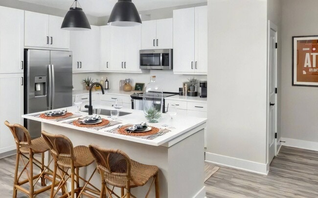 The island doubles as a breakfast bar and still leaves prep space.