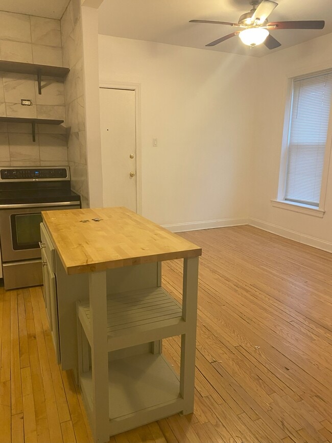 Open kitchen to dining-living room - 2900 N Richmond St Unit 1R