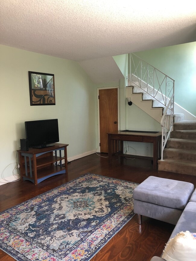 Living room/stairs - 4111 Wade St Unit Apt D