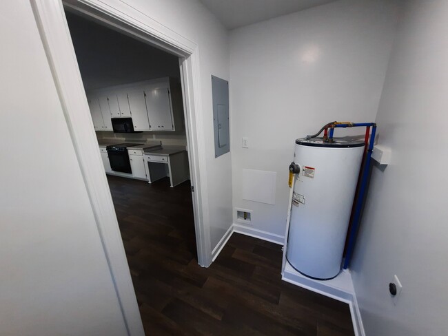 Laundry/mud room conveniently located off of kitchen next to back door. - 1717 Old Barn Rd House