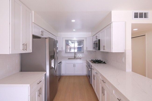 Photo - IN-UNIT LAUNDRY WITH ON-SITE PARKING!! Unit 104