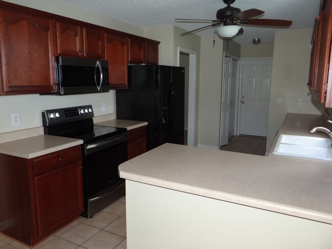Photo - Lovely 3 bedroom 2 bath home in 55 and older neighborhood with 2 car garage