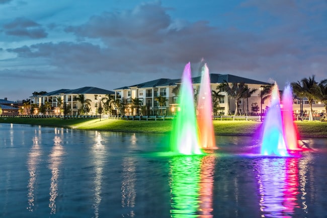 Lake with illuminated fountains - The Reserve at Coral Springs Apartments