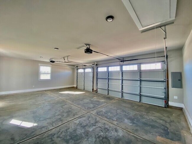 Photo - Clift Farm townhome with a fence and 3 car garage