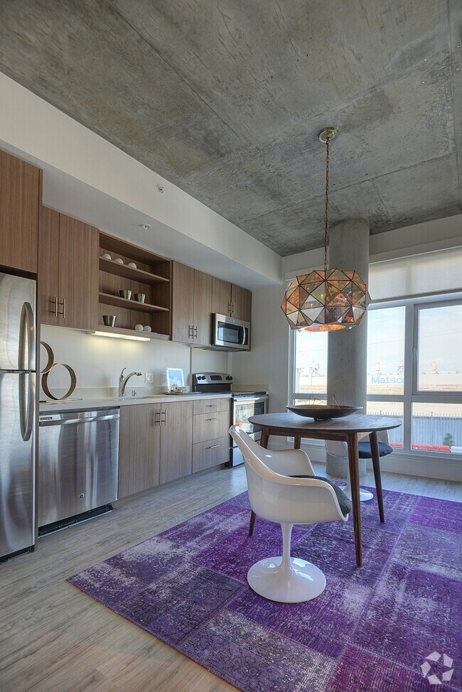 Stylish kitchen with stainless steel appliances and quartz countertops - The Gantry Rental