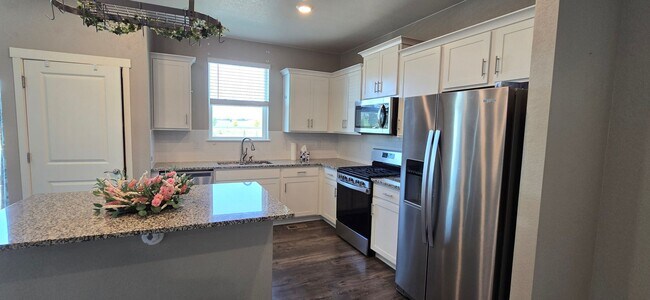 Photo - Discover this spacious 4-bedroom, 2.5-bath home in Mead, CO!