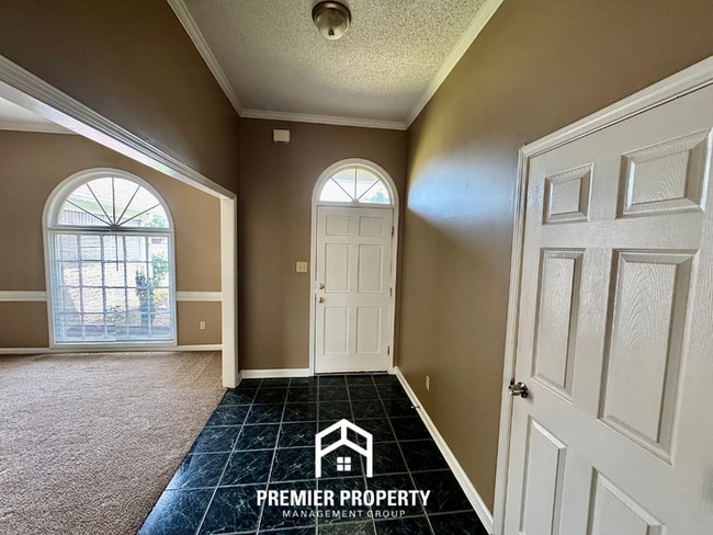 Photo - Spacious 3BR/2BA Near Southwind | 1,958 Sq Ft, Brick Fireplace, 2-Car Garage & Quiet Cove