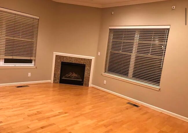 spacious bedroom w/high ceilings and electric firecan fit any size bed, desk, furniture comfortably - 373 Florence St House