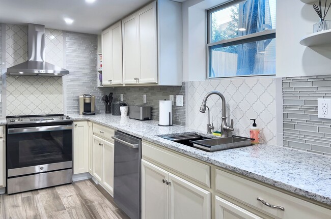Photo - Discover the charm of this FULLY FURNISHED basement unit, tucked away in a beautifully updated bu...
