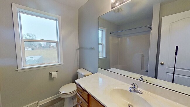 Photo - Move-In Ready 2BR Townhouse w/ Central AC & Off-Street Parking