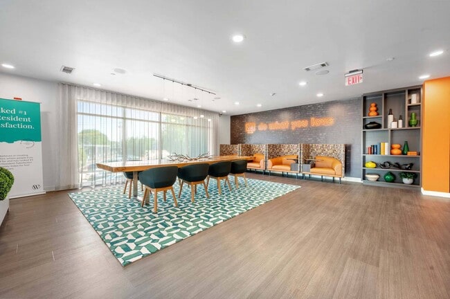 Gather around the dining table and booths, a versatile space for meals, work, or catching up with friends.