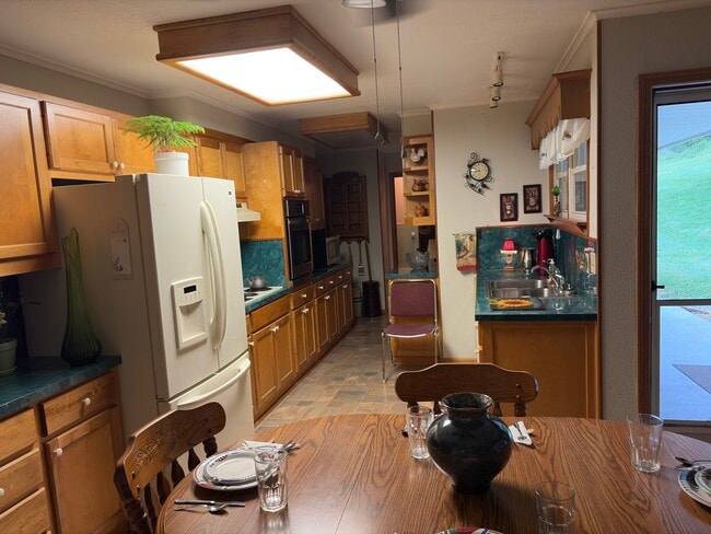 Bright, open kitchen with ample room for making a great meal and sharing with family/friends. - 1121 Linville Creek Rd