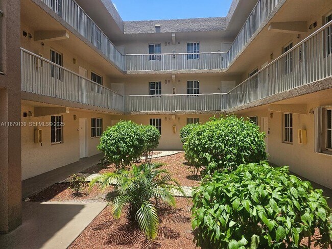 Building Photo - 6115 NW 186th St Unit 105