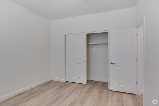 3BR, 2BA - 1,572SF - Bedroom - Woodcrest at Power Ranch Apartments