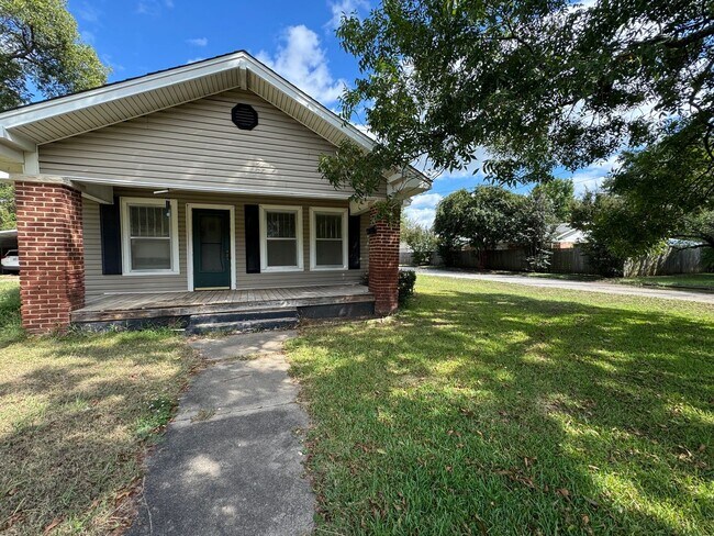 Photo - Three bedroom two bath home with central heat and air, large fenced backyard, and carport!