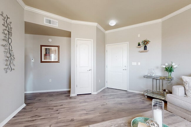 Step into style with this beautifully adorned living space, a perfect blend of sophistication and comfort. - Las Mananitas Apartments