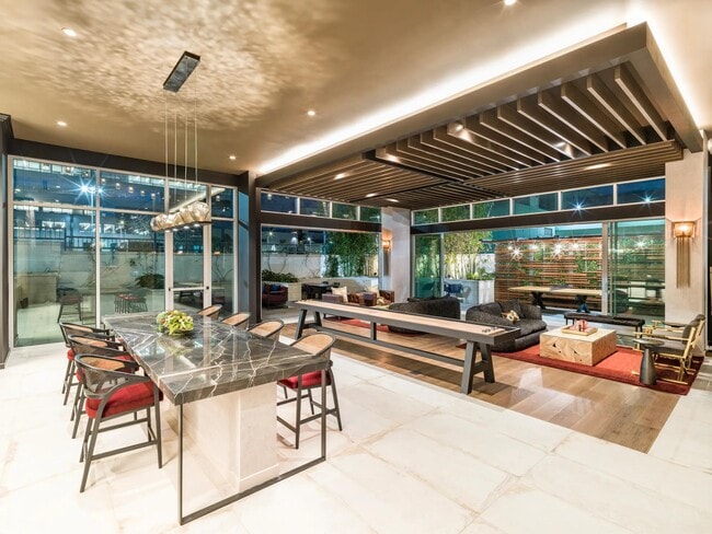 Sophisticated lounge spaces at Modera Argyle feature stylish seating, shuffleboard, and inviting areas to relax, entertain, or connect with neighbors.