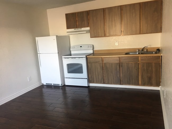 Kitchen Furnished with Refridge. & Stove - Downtown Apartments