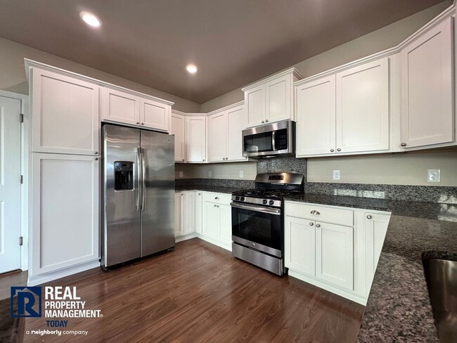 Photo - Spacious 4-Bedroom Home with Fenced Yard & 2-Car Garage Near JBLM!