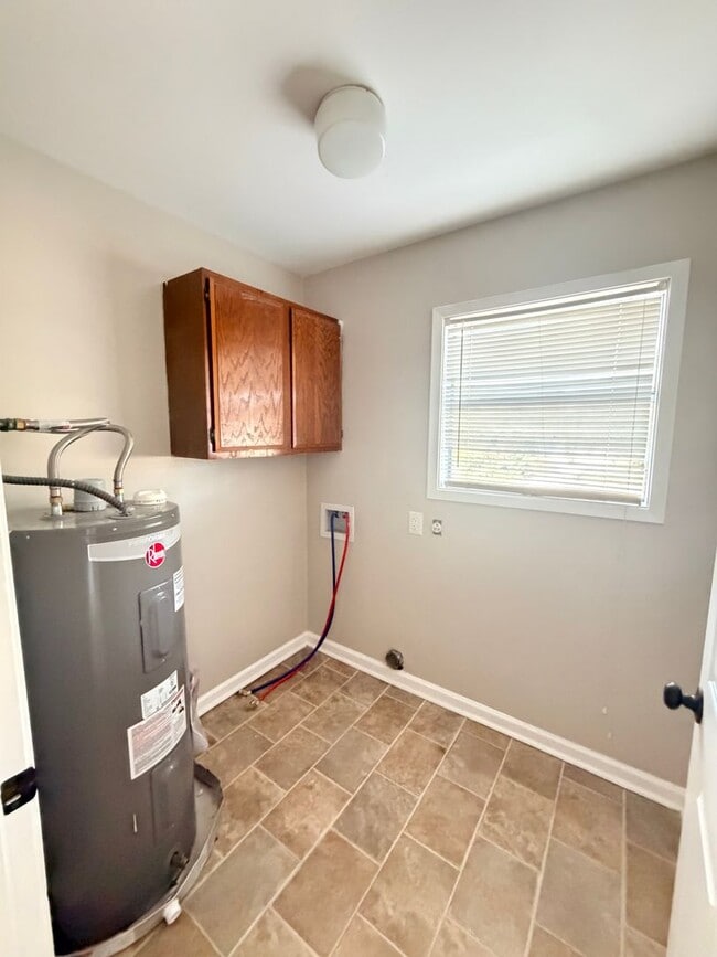 Photo - Upstairs 2/1 apartment with fresh paint and  updated flooring.