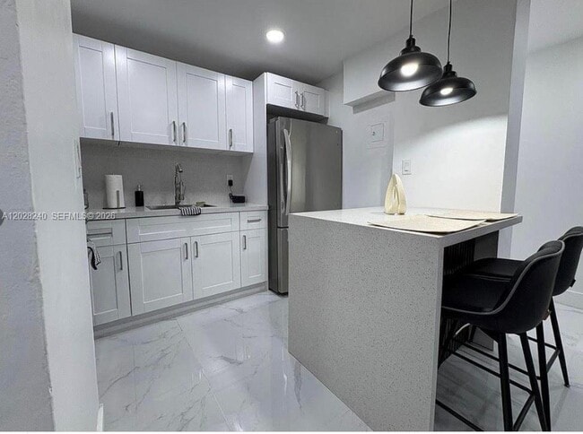 Building Photo - 4265 NW S Tamiami Canal Dr Unit 1-211