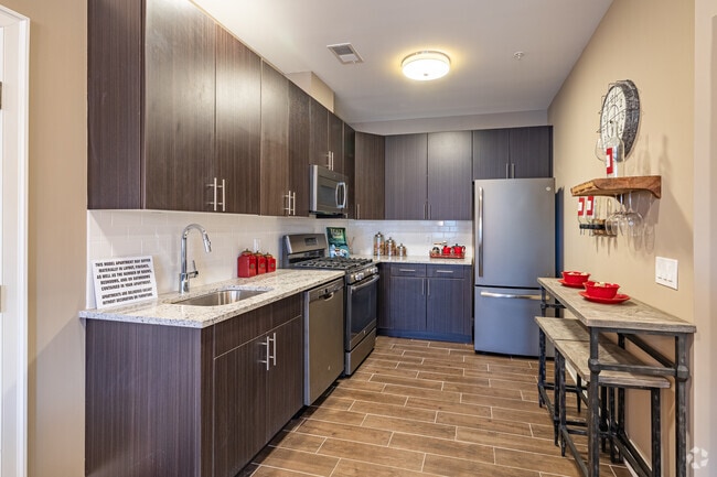 1BR, 1.5BA w/Den - 890SF - The Amsterdam II - Kitchen