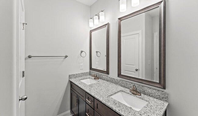 Large bathrooms with granite countertops and large vanities