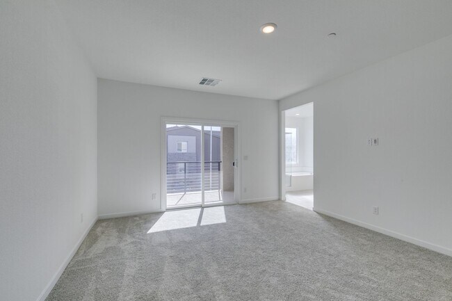 Photo - Stylish Townhome Featuring Open-Concept Living & Primary Suite Balcony