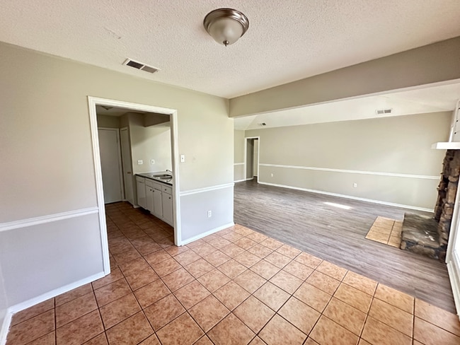 Photo - Charming 3BR/2BA Near Southwind | Soaring Vaulted Ceilings, Rustic Fireplace & Garage
