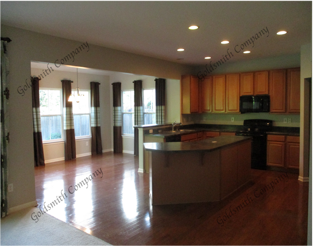 "4-Bed in Greenville - Spacious 2,389 Sq Ft with Fireplace & Hardwood Floors!"