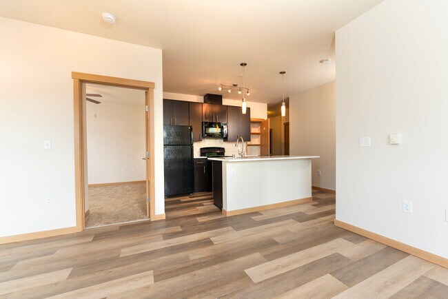 Open-Concept Kitchen with Island & LVP Floors | Marketplace Flats